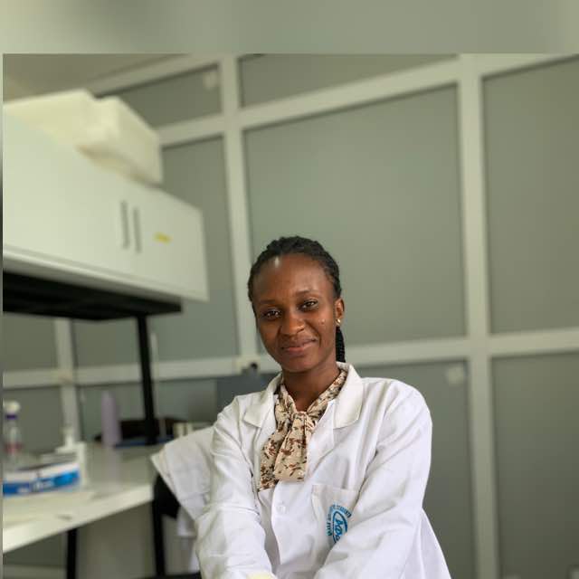Hagar Apatewen, founder of Purl Kernel, in a lab coat in the laboratory